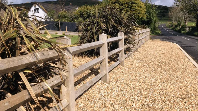 Fence and stone front garden